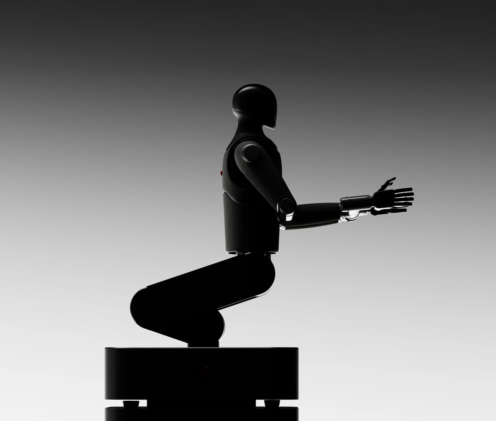 MARK One seated on its base with an outstretched hand